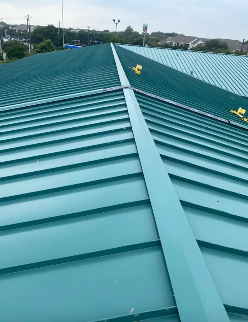Green commercial metal roof ridge and valley for Metal Roof Repair in Ridgewood village