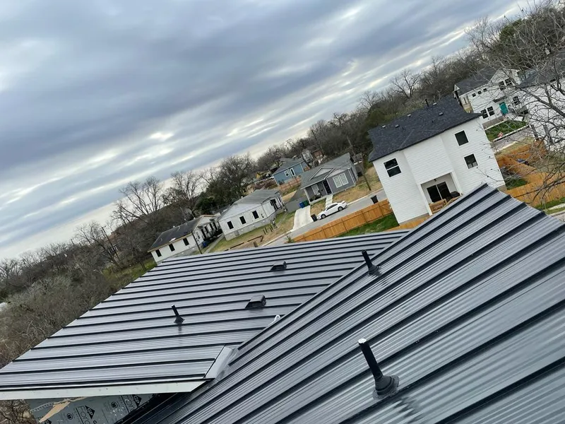 Standing seam metal roof panels with vents for Skylight Repair in Ridgewood village